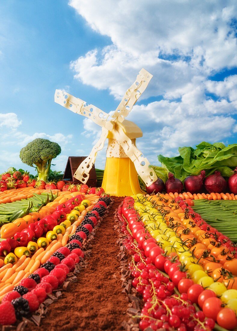 Holländische Landschaft aus Obst und Gemüse mit Windmühle aus Käse