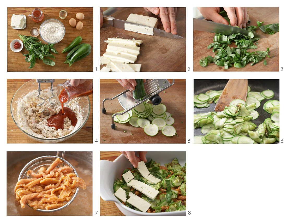 Gratinated tomato egg noodles with feta cheese being made