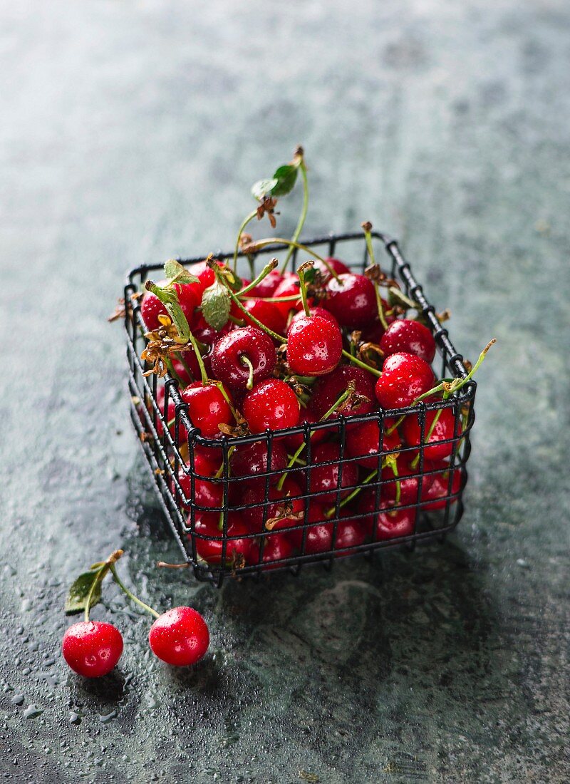 Sour cherries in a small wire basket