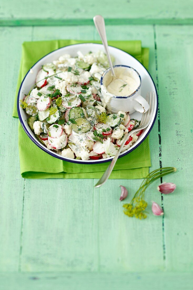 Radish salad with cauliflower, cucumber and a yoghurt and herb mayonnaise