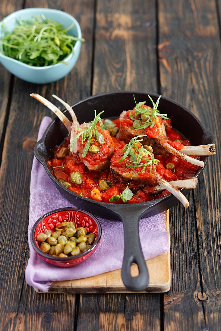 Lamb chops with a tomato and caper sauce