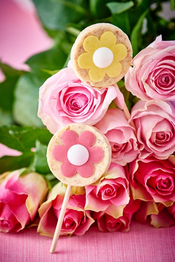 White chocolate lollies with marzipan flowers