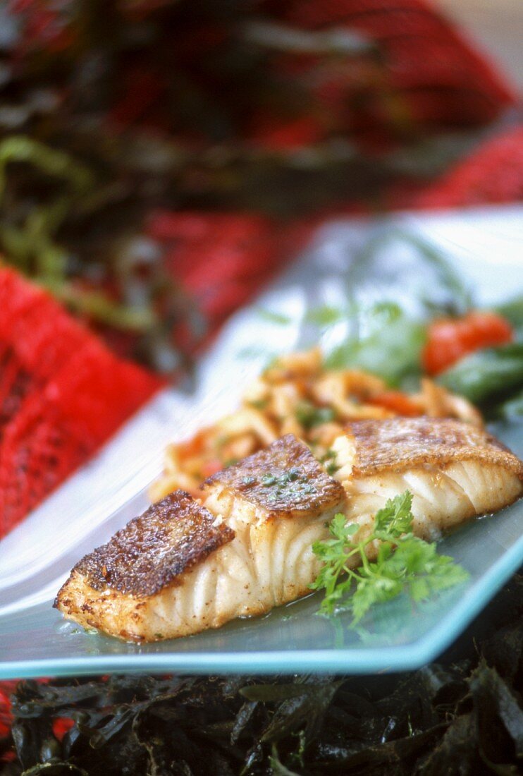 Fried salmon fillet on a serving platter