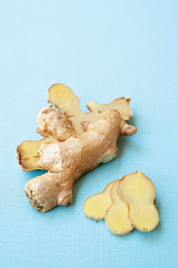 Fresh ginger root, halved and sliced