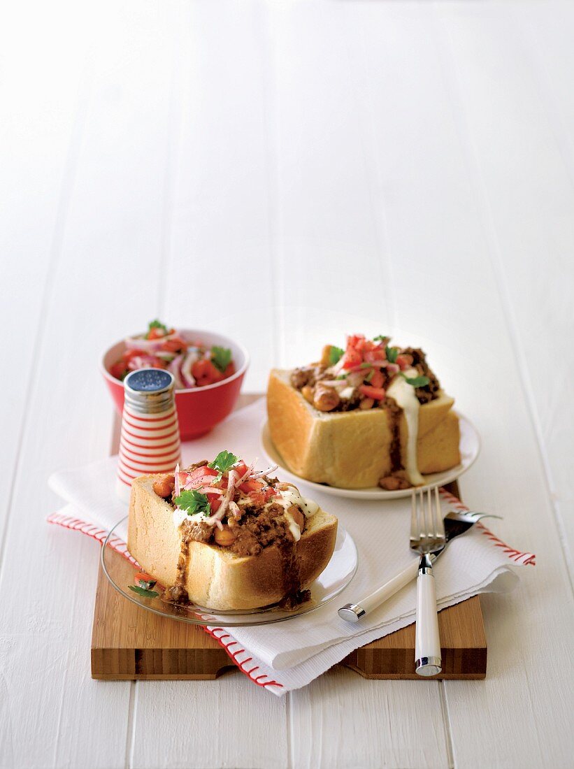 Bread with a lamb filling, tomatoes, yoghurt and coriander