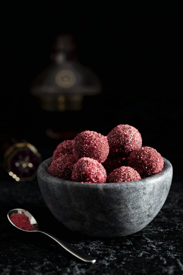 Raspberry & chocolate truffles in a stone bowl