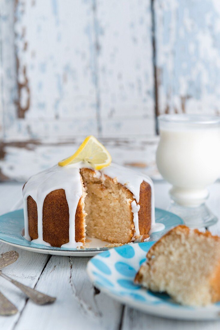 Vegan lemon drizzle cake with white icing