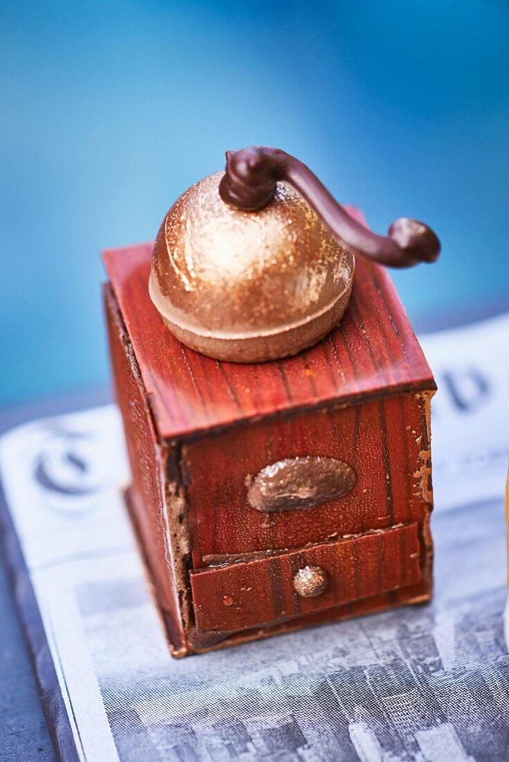An old-fashioned coffee grinder made from chocolate