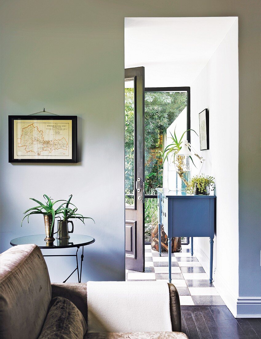 View from living room into foyer and through to open front door