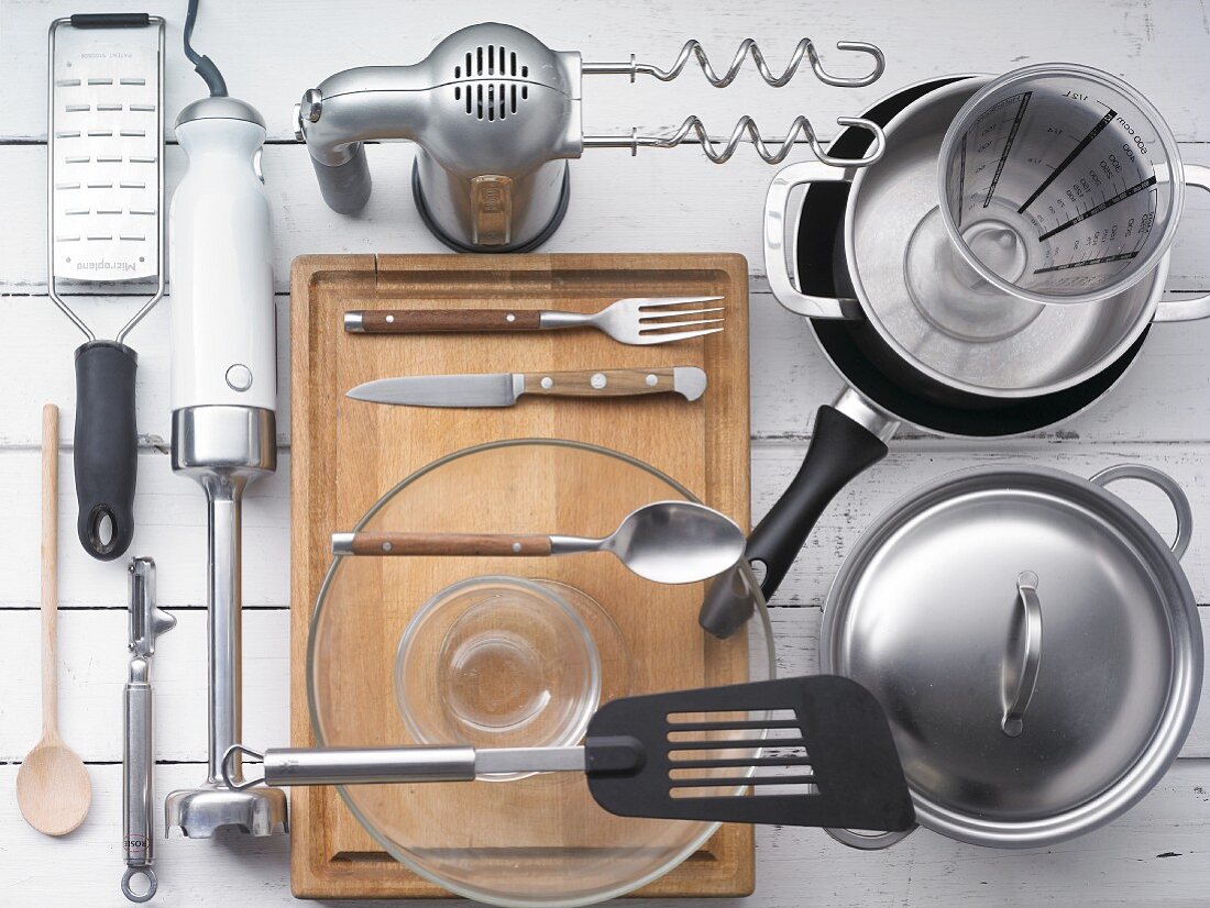 Kitchen utensils for preparing burgers and potatoes