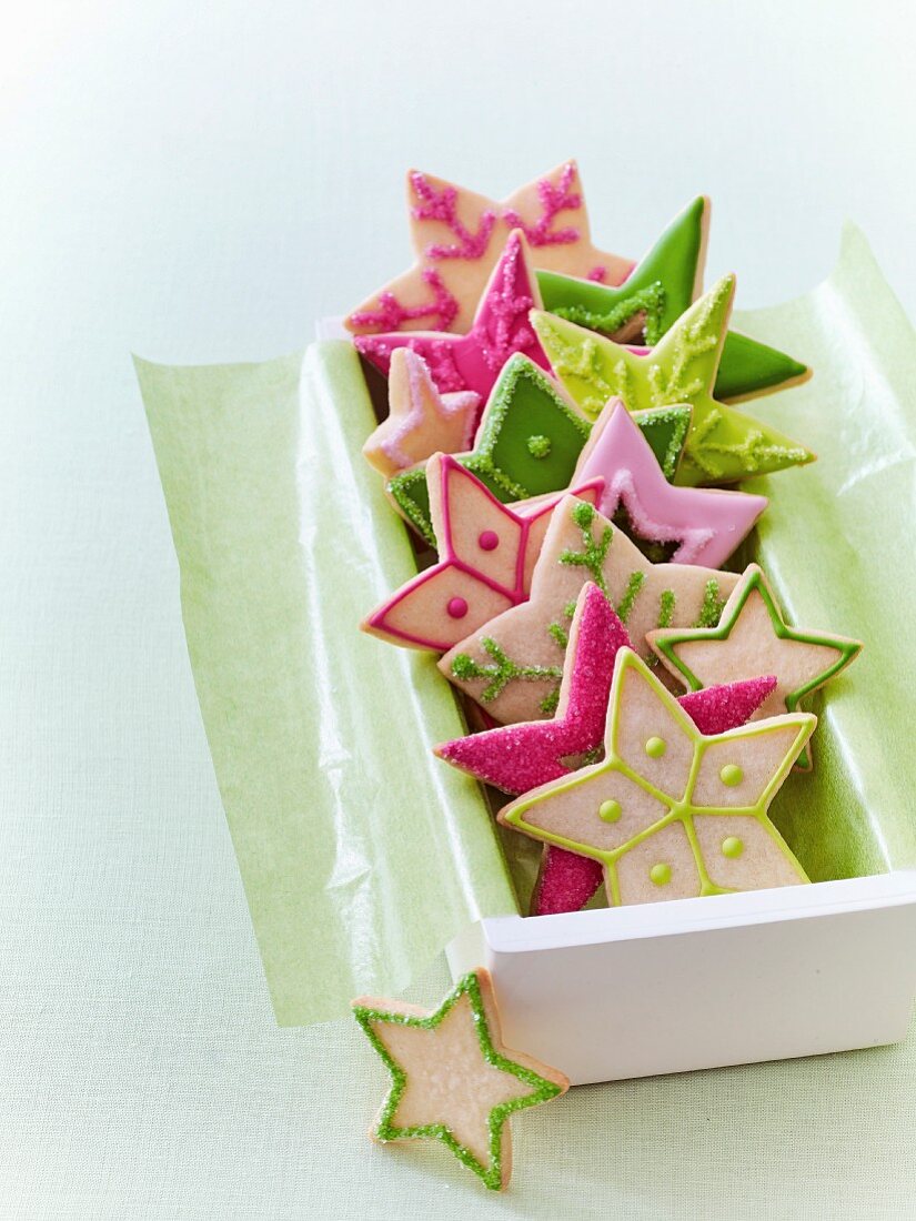 Colourful Christmas star biscuits in a gift box