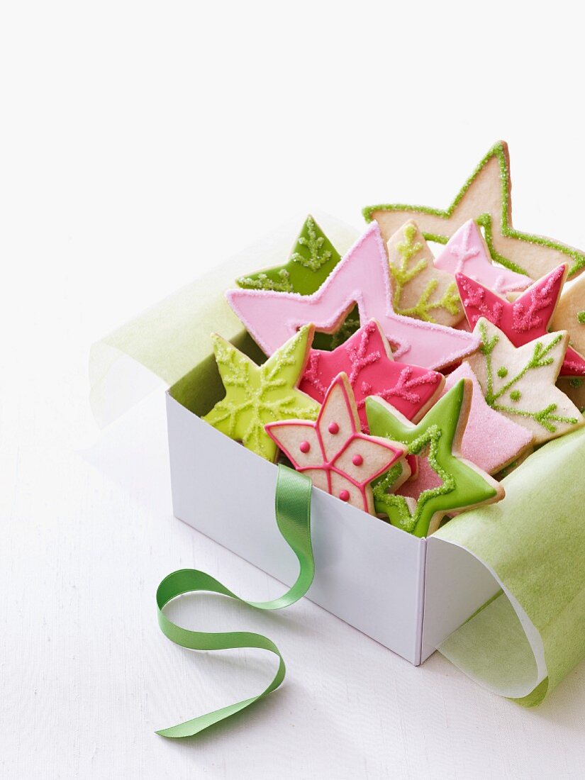 Colourful Christmas star biscuits in a gift box
