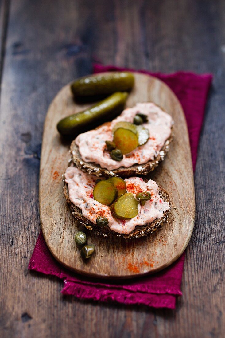 Slices of bread with Liptauer cheese spread and gherkins
