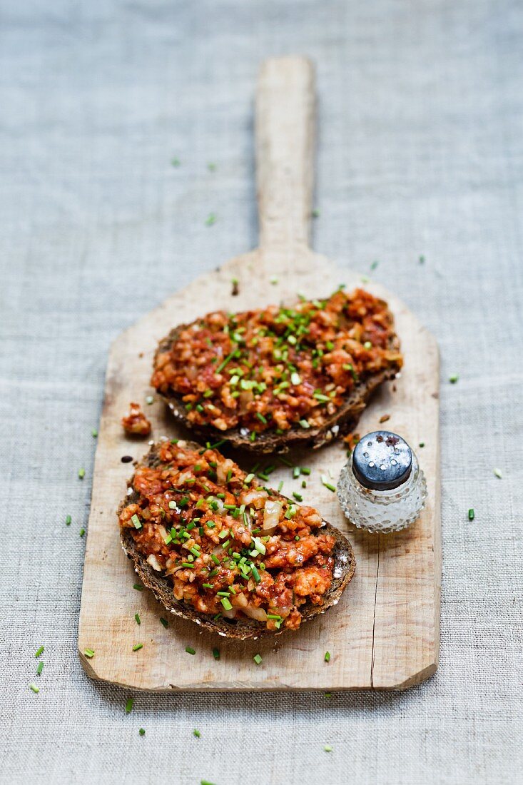 Bread with a rice cracker and sausage pâté spread