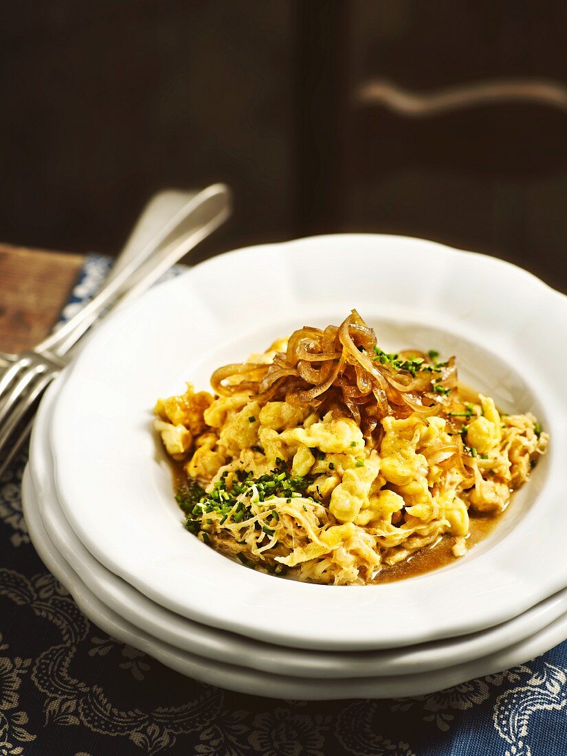 Bayarian 'Krautspaetzle' (soft egg noodles with herbs) with onions in beer sauce