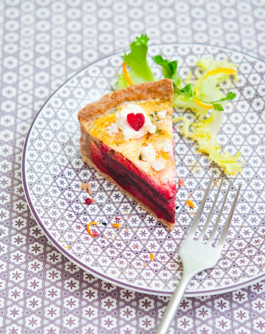 A slice of beetroot and orange quiche
