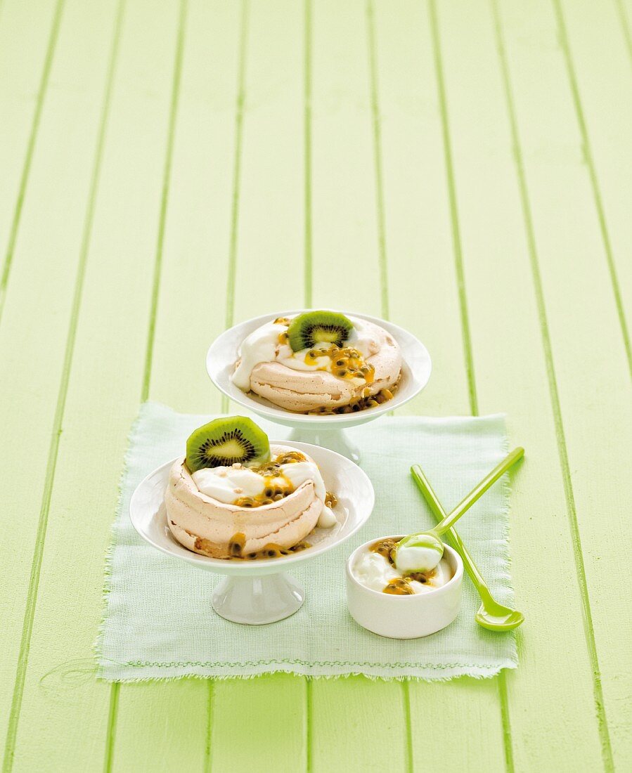 Mini pavlovas with passion fruit cream and kiwi