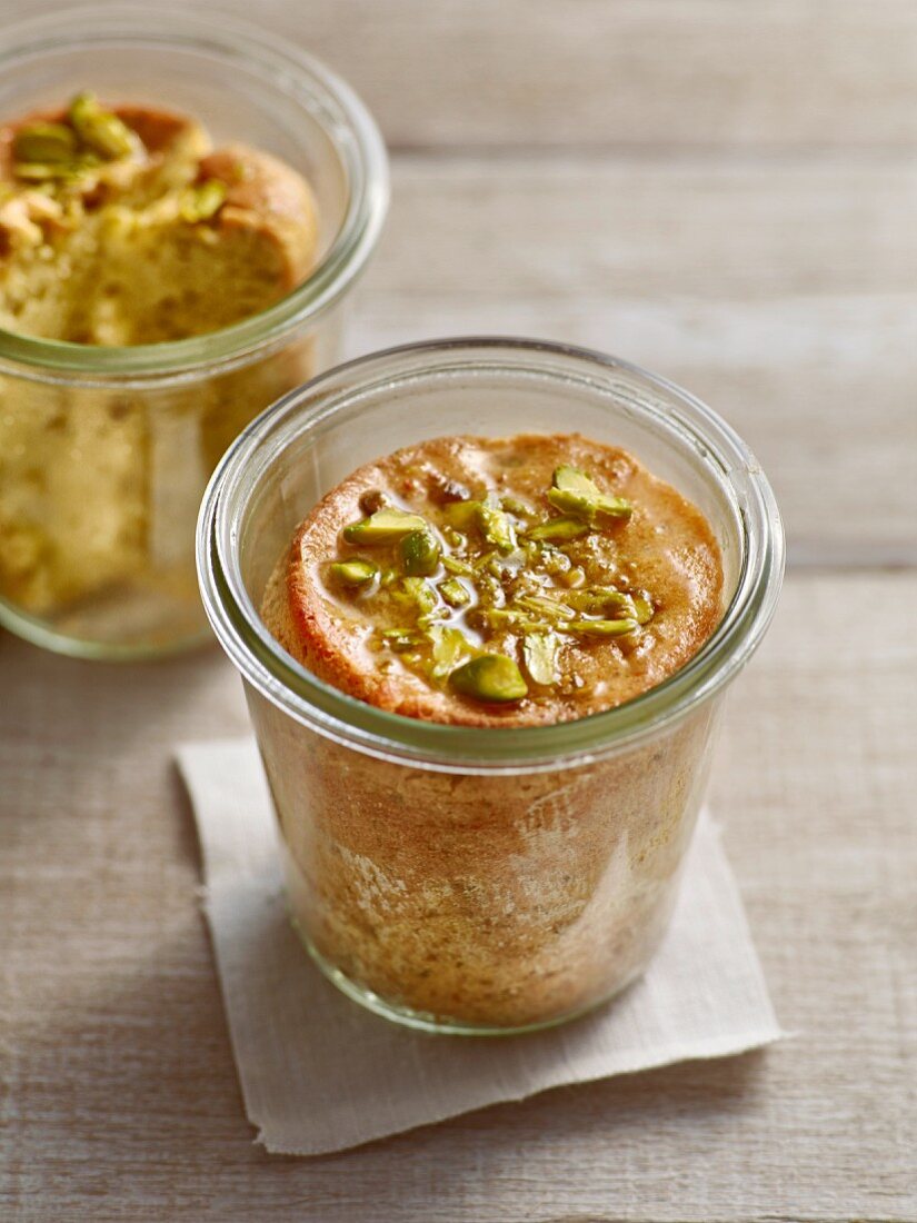 Pistachio and rose water cakes in glass jars