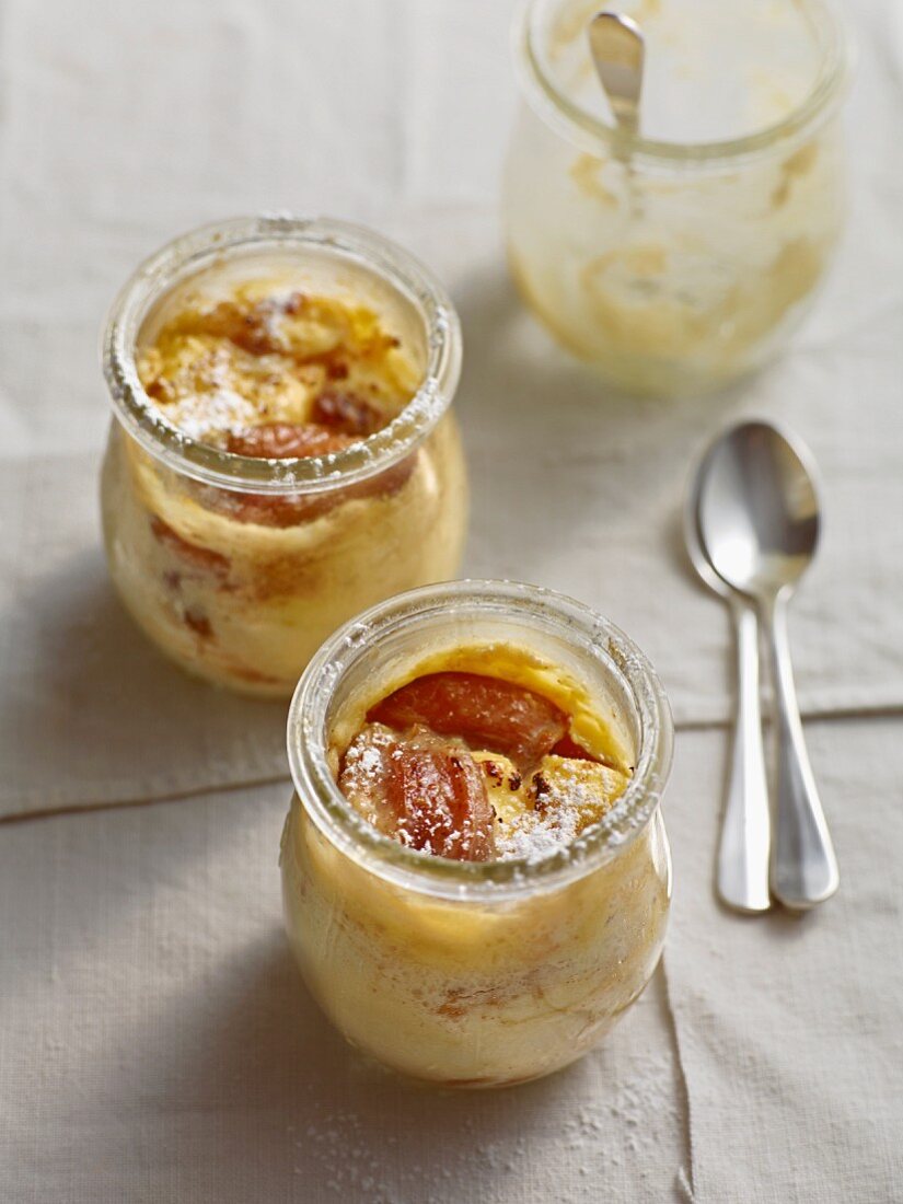 Bavarian Topfenstrudel (strudel with a soft quark cheese) with caramelised plums served in glass jars