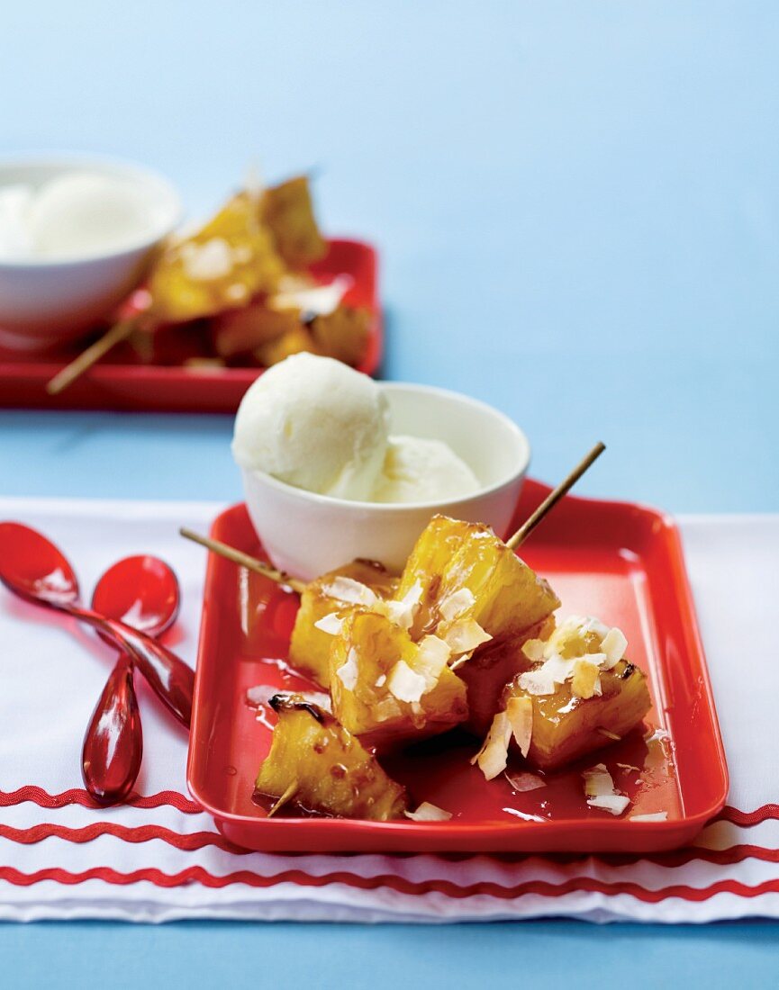 Pineapple kebabs with coconut and vanilla ice cream