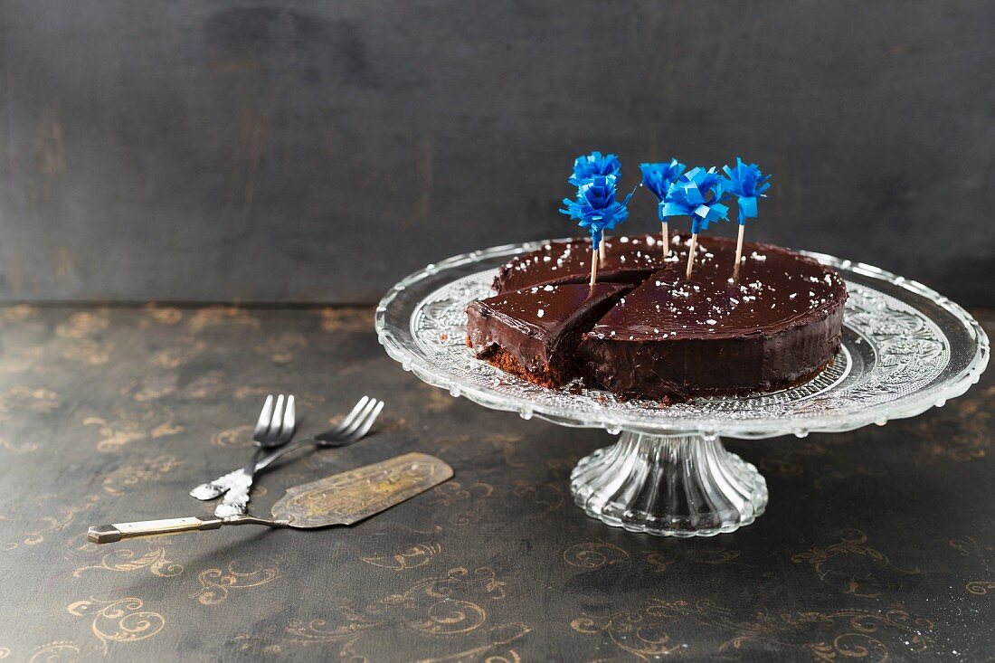 Chocolate cake with blue flower decorations