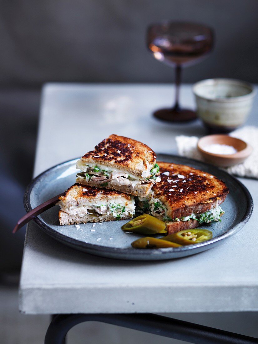 Chicken and provolone toastie with pickles and caper aiol