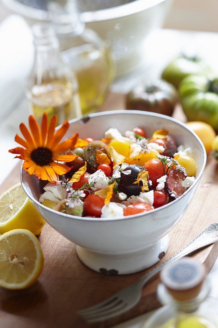 Tomato salad with cheese and edible flowers