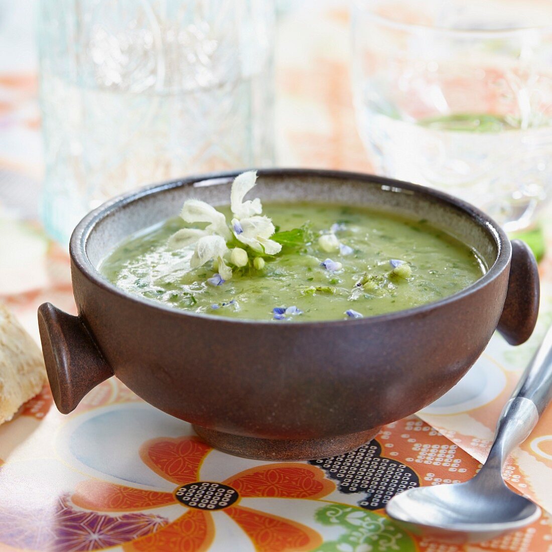 Nettle soup with edible flowers