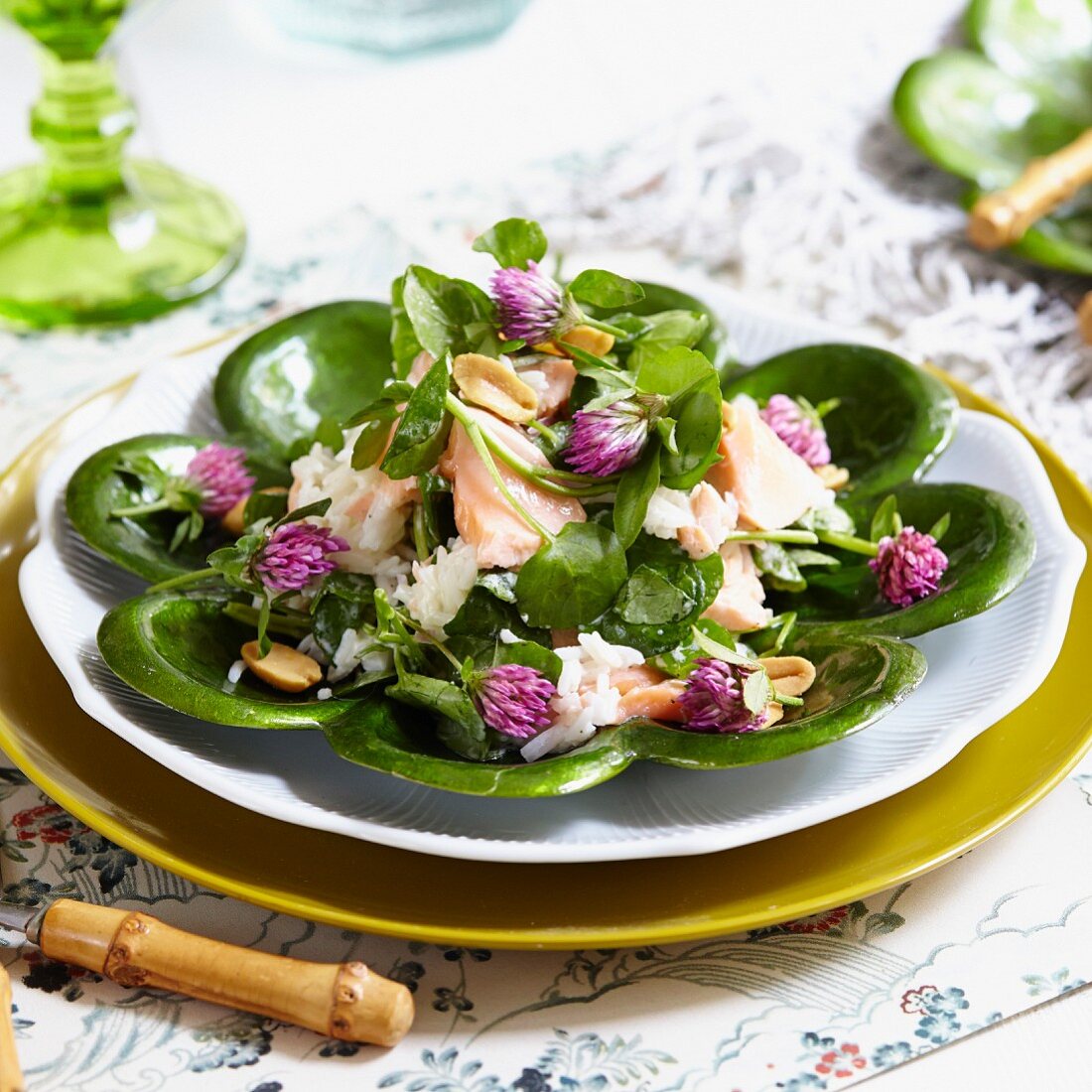 Watercress salad with salmon, clover flowers and peanuts