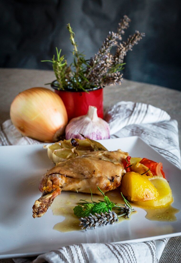 Roast rabbit with vegetables and herbs