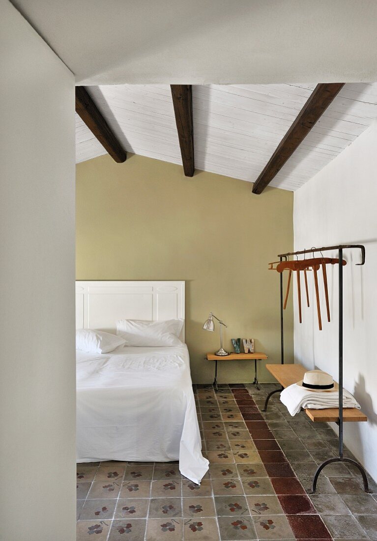 Mediterranean hotel room with traditional tiled floor in restored period building