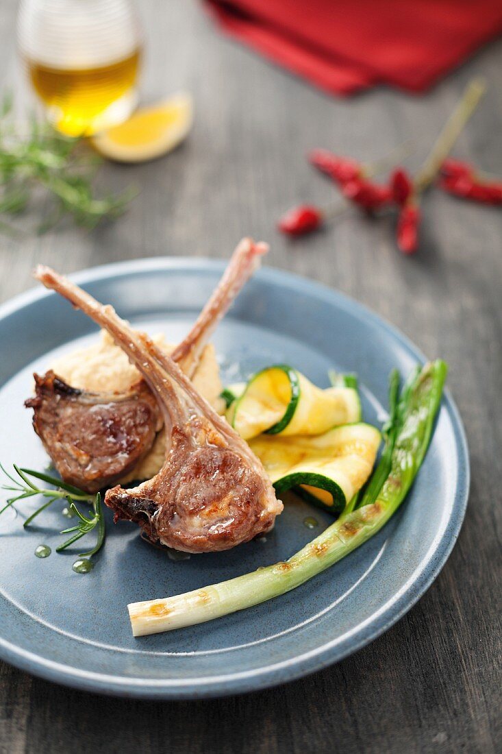 Marinated lamb chops with chickpea purée and a side of vegetables