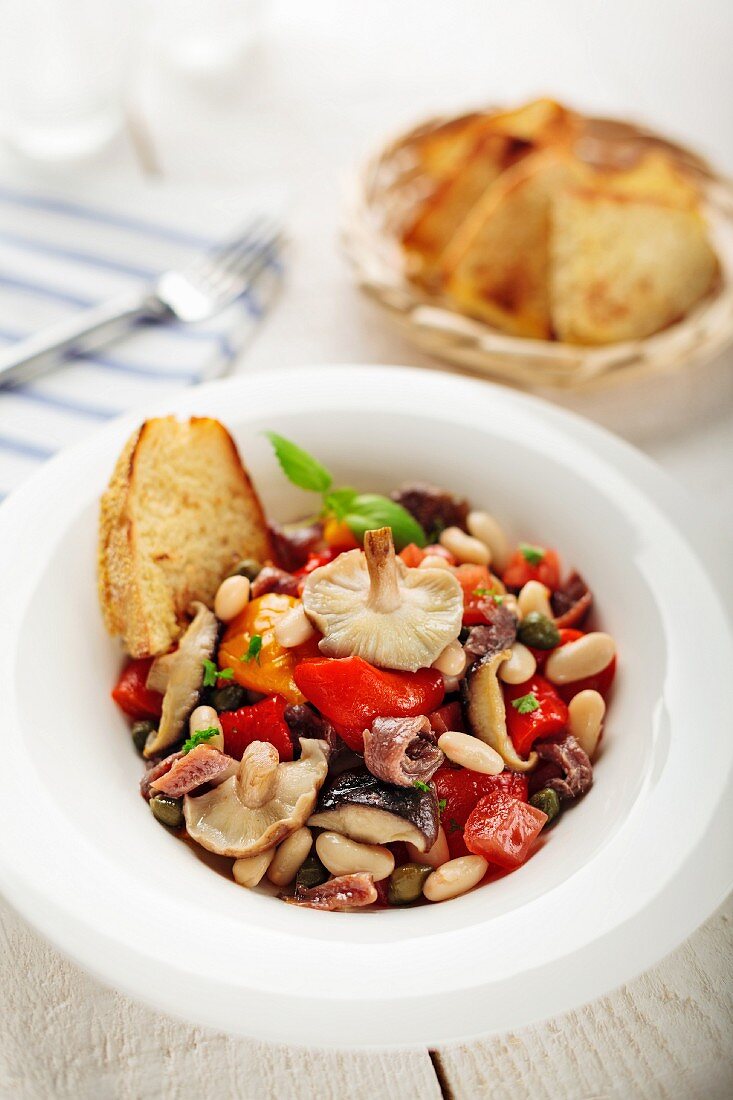 Anchovy salad with shiitake mushrooms, white beans and pepper