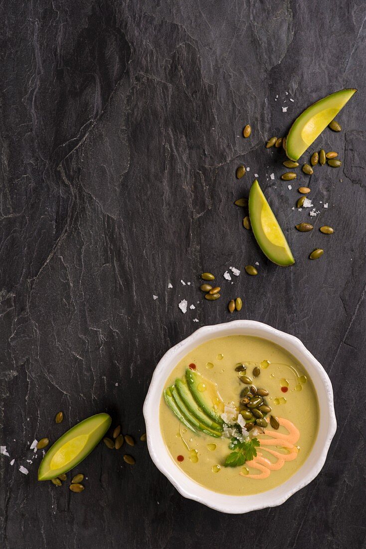 Chilled avocado soup with pumpkin seeds (seen from above)