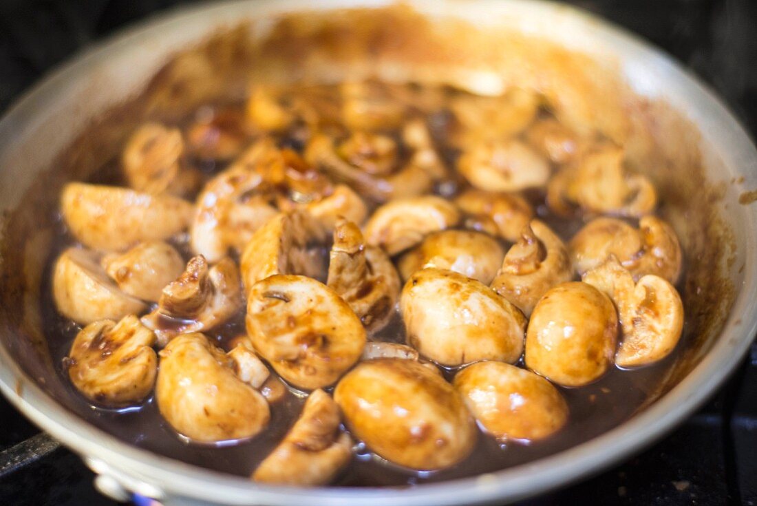 Braised mushrooms in a frying pan