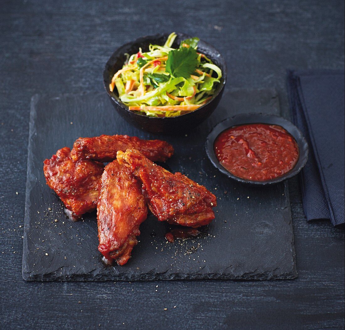 Marinated chicken wings with a pointed cabbage and carrot salad