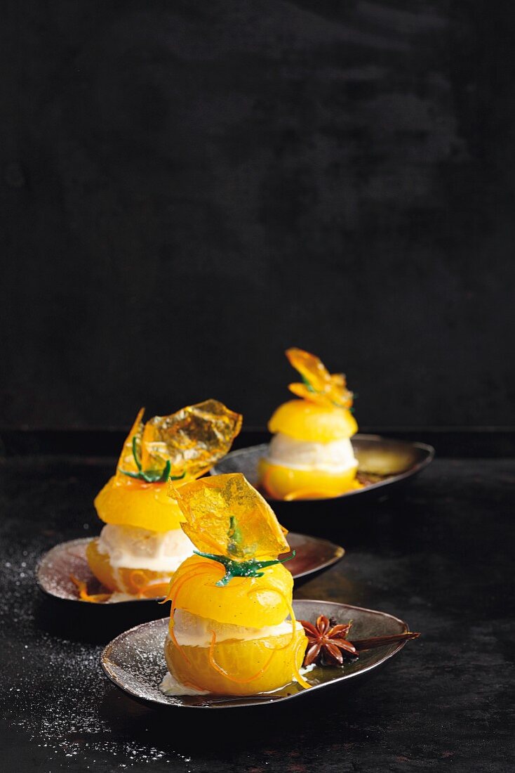 Filled yellow tomatoes with spicy orange syrup and vanilla ice cream