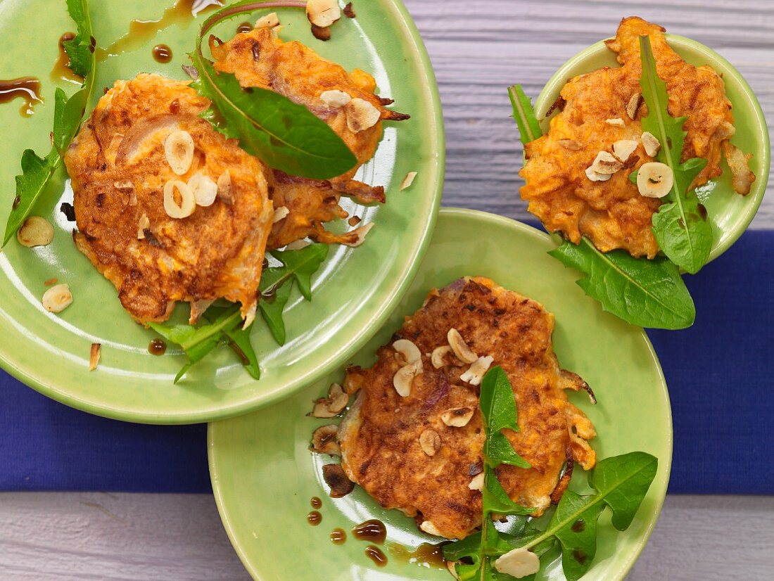 Sweet potato fritters with dandelion leaves and nuts