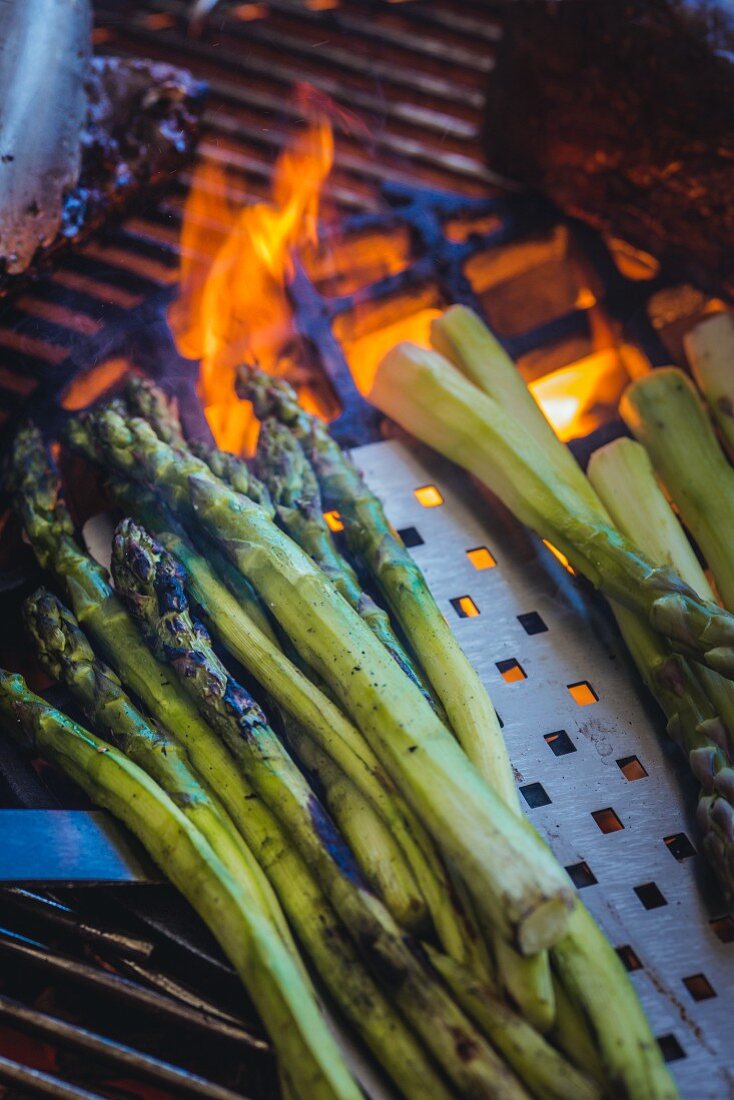Grilled green asparagus on the barbecue