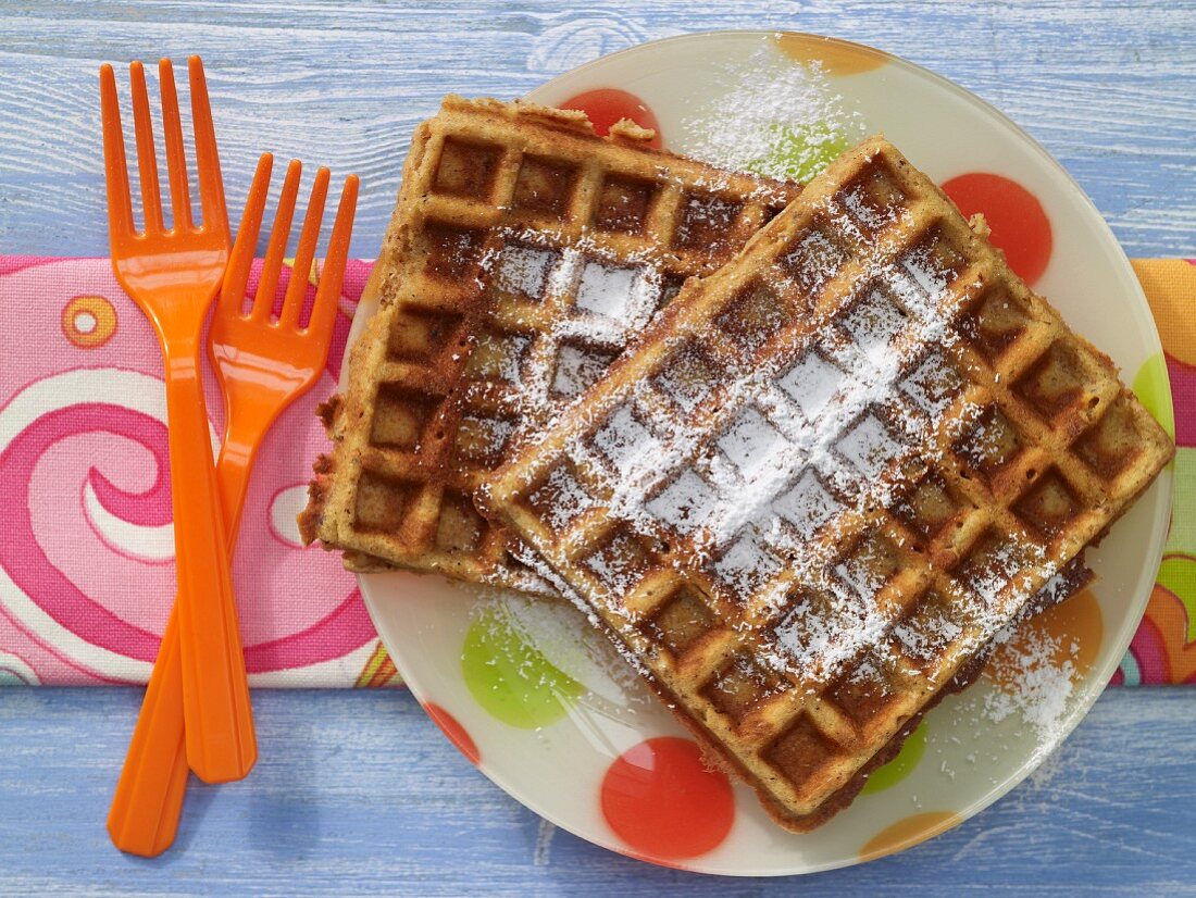 Nut waffles with honey and icing sugar