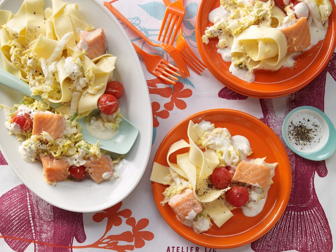 Salmon with tagliatelle and vegetables in a creamy sauce