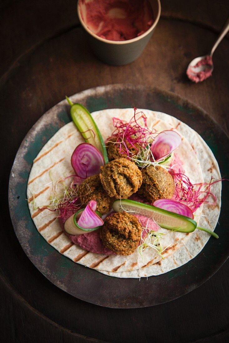 Vegan falafel with beetroot on a tortilla