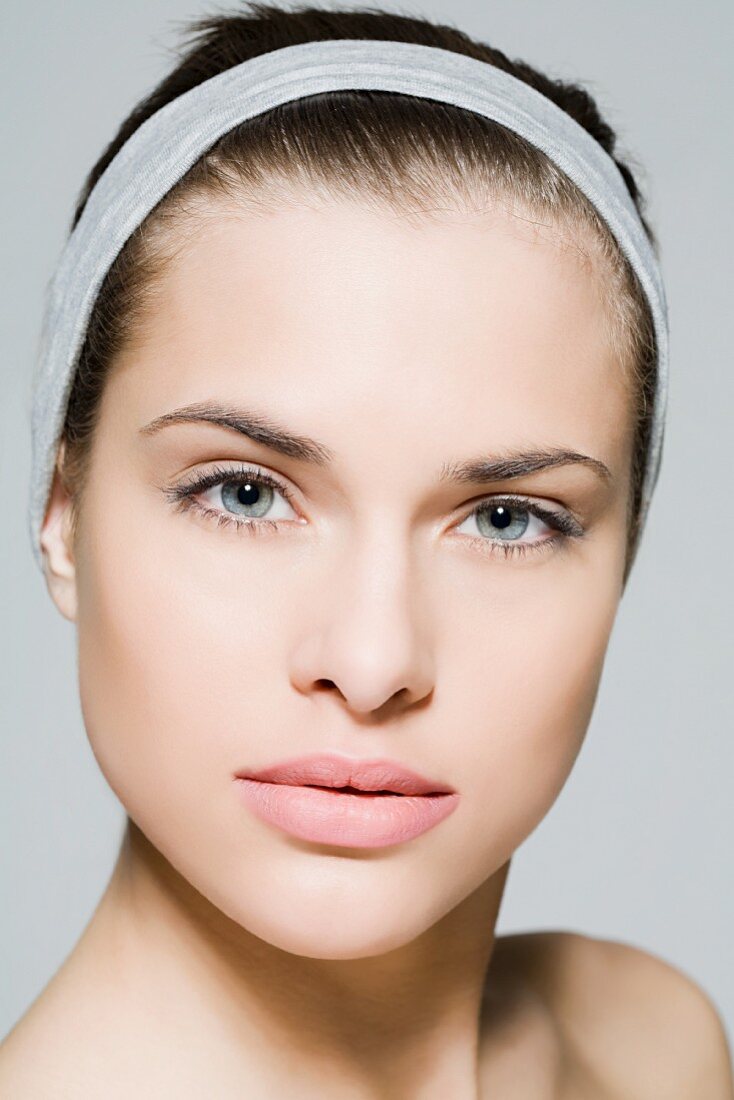 A Young Woman Wearing White Hair Band