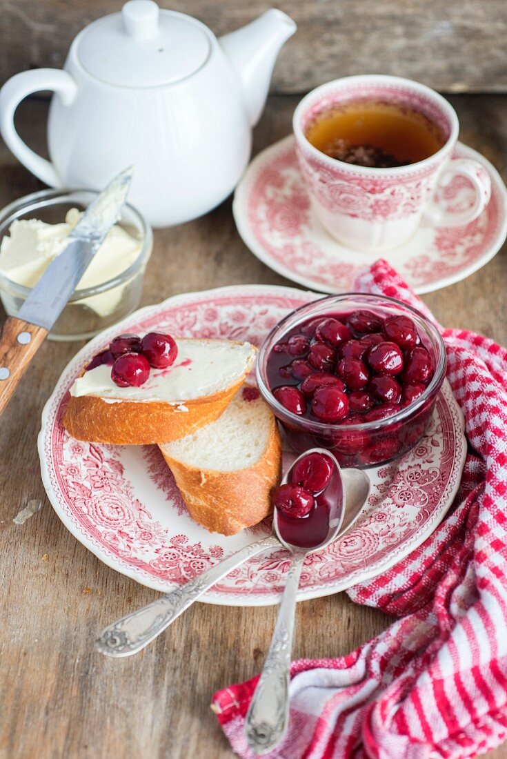 Cherry jam with two slices of bread and butter