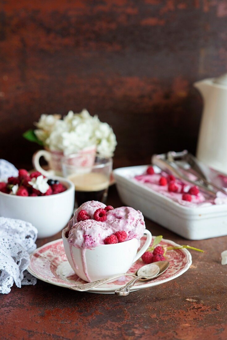 Three scoops of home-made raspberry ice cream in a cup