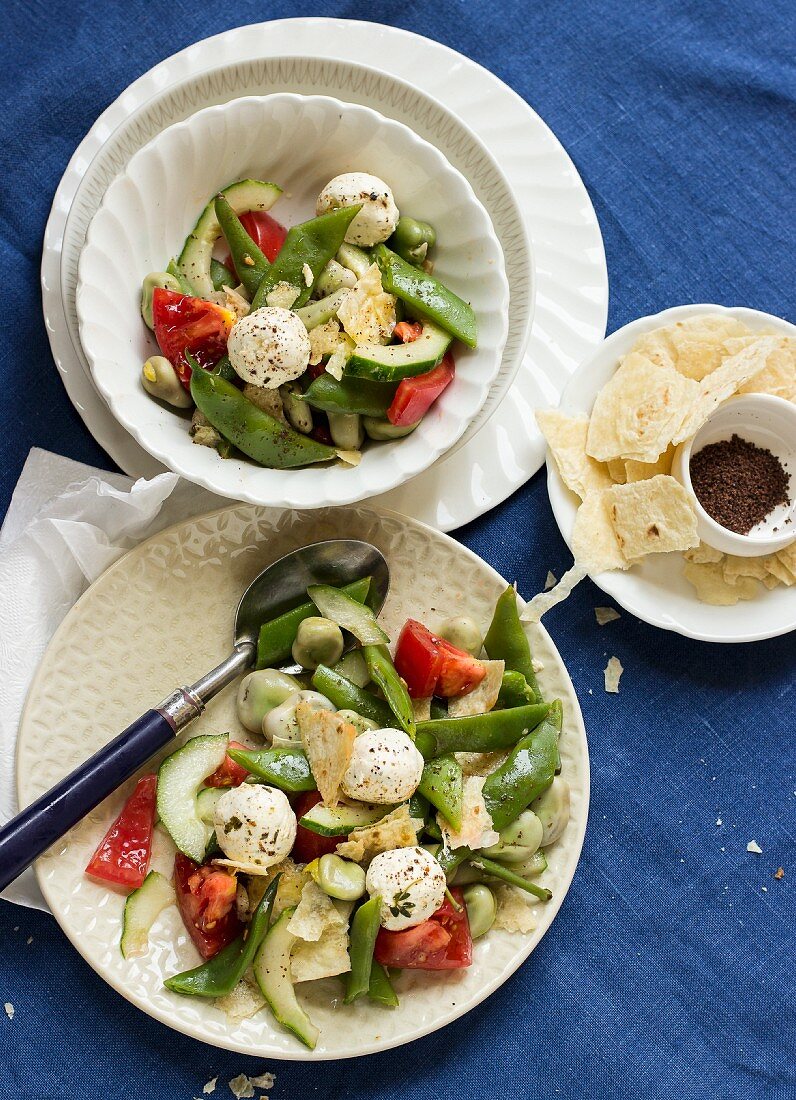 Fattoush salad with broad beans, tomato, cucumber, labneh cheese and pita bread
