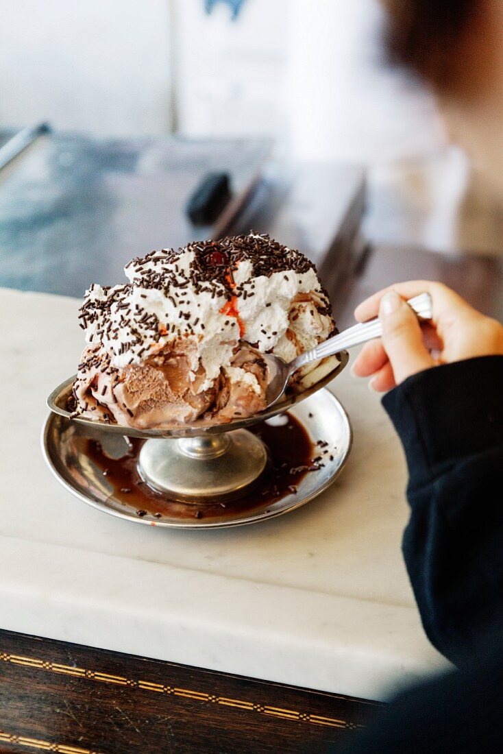 An old-fashioned ice cream sundae in an ice cream parlour