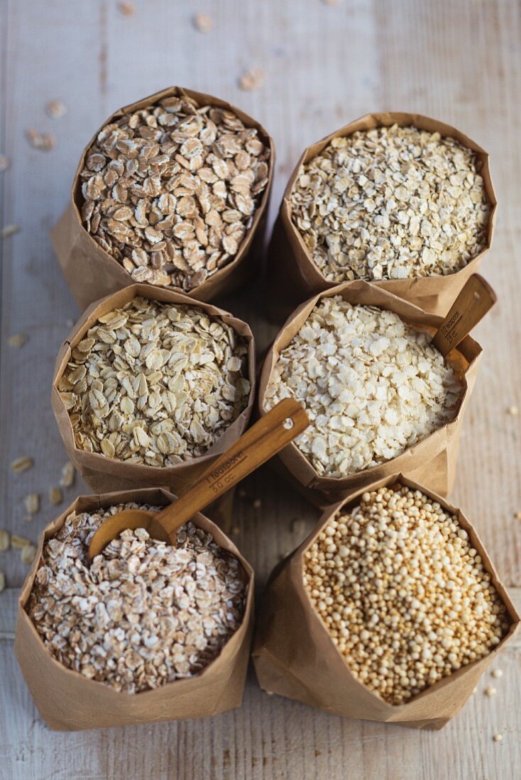 Six different types of grain in paper bags