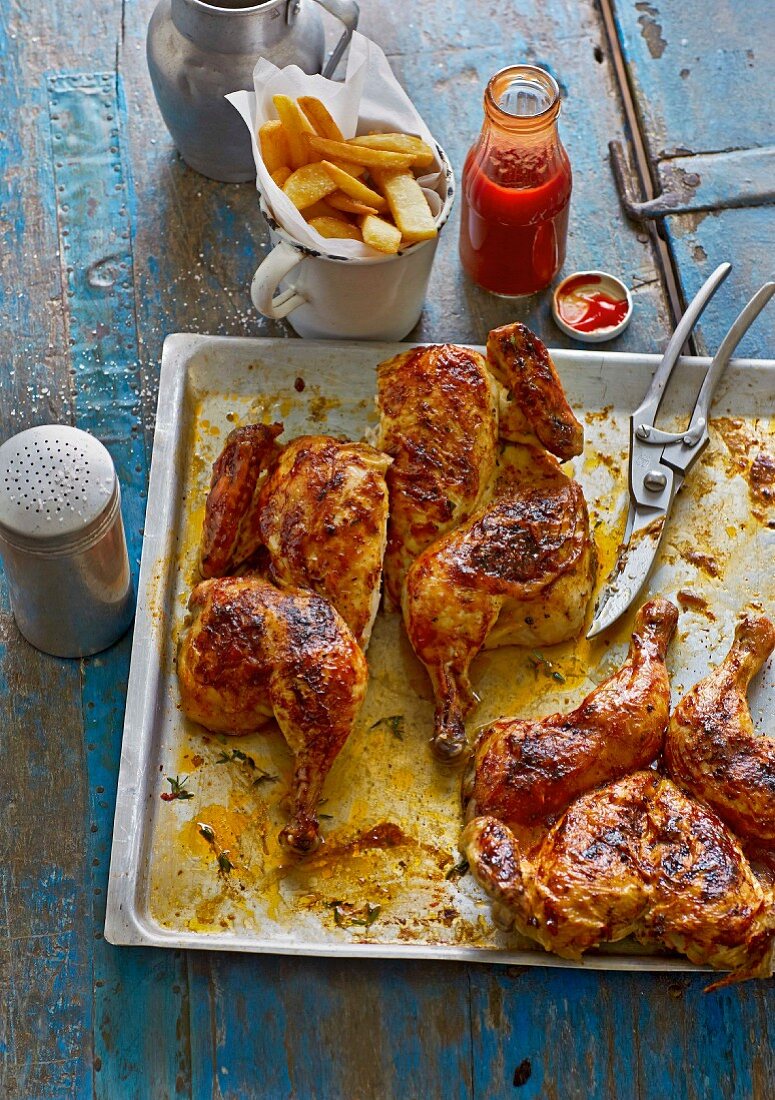 American BBQ butterfly chicken with chips and ketchup