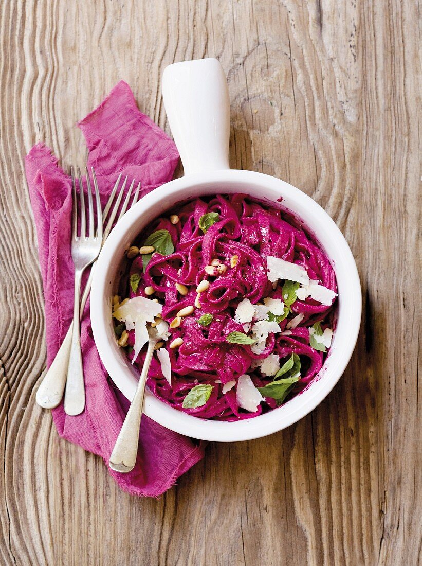 Tagliatelle with beetroot pesto, Parmesan and pine nuts